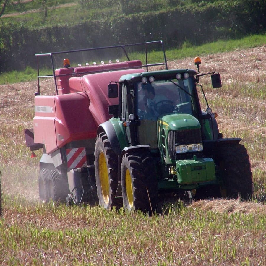 Miscanthus offers full management services of the crop - here we have a John Deere tractor baling the Miscanthus cane ready for moving to storage.