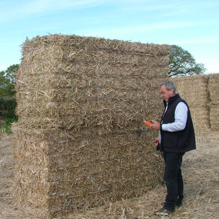 Mike Cooper (Commercial Director) out in the field checking the moisture content of the miscanthus x giganteus bales before being moved to storage.