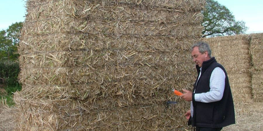 Mike Cooper (Commercial Director) out in the field checking the moisture content of the miscanthus x giganteus bales before being moved to storage.
